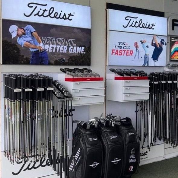 Rows of golf clubs and shafts on a fitting display